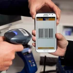 A customer paying with a smartphone using a mobile payment app
