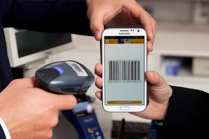 A customer paying with a smartphone using a mobile payment app