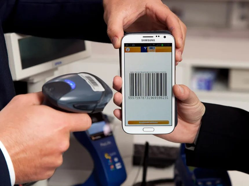 A customer paying with a smartphone using a mobile payment app
