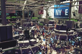 Traders at work on the floor of the New York Stock Exchange