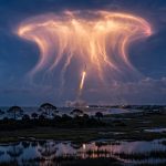 SpaceX rocket launch at twilight creating a glowing jellyfish-shaped cloud over the US East Coast